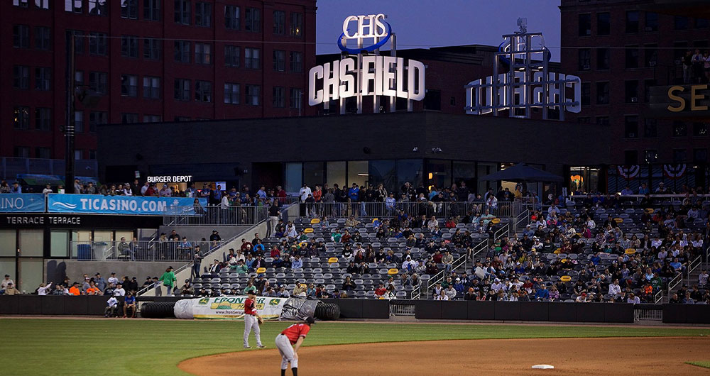 Saints baseball team playing at CHS Field at night