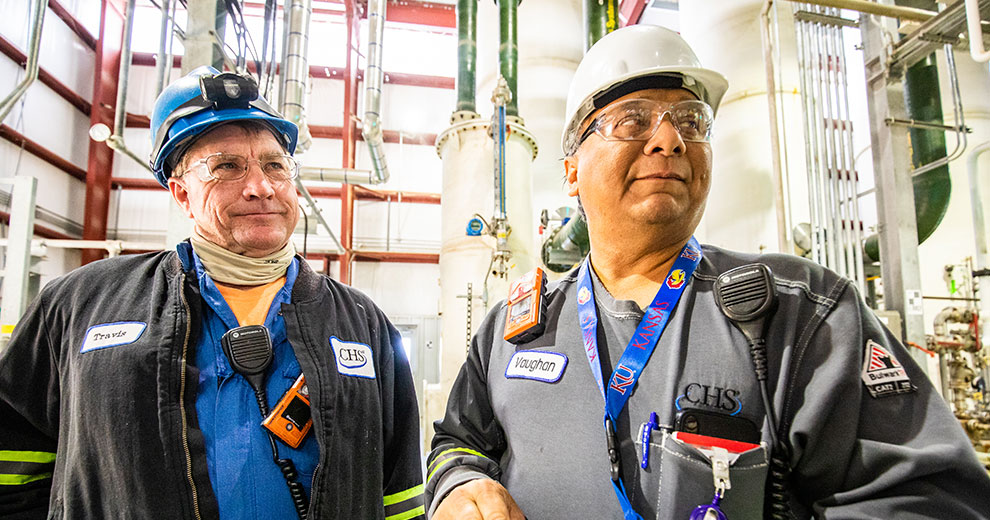 two-refinery-workers-990x520