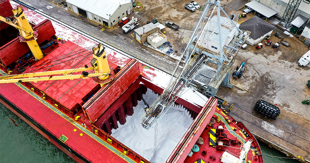 Fertilizer being loaded onto a freight boat