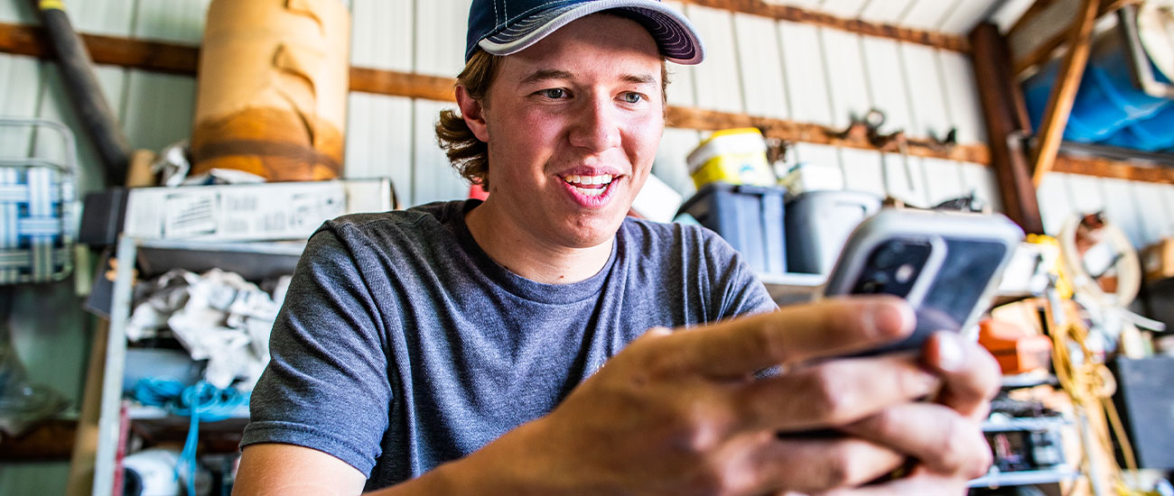 Man looking down at cell phone