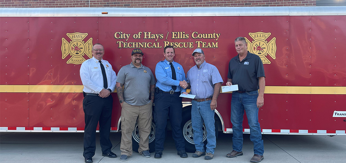 Men standing in front of fire truck