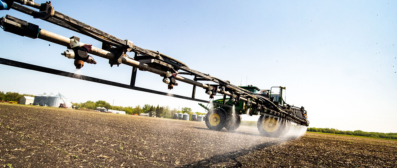 Tractor spraying crop protection