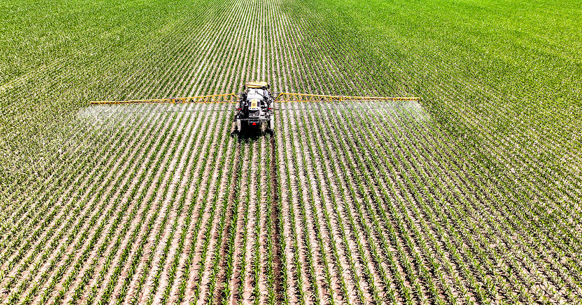 A sprayer putting down crop protection.