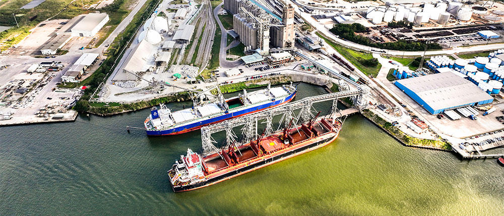Two ships being loaded with grain
