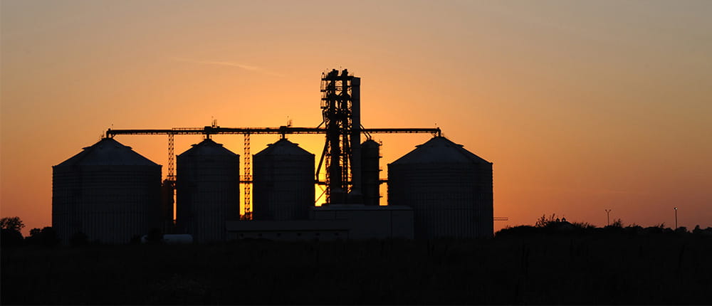 grain bins at dusk