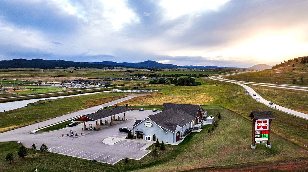 Aerial photo of travel plaza next to a highway