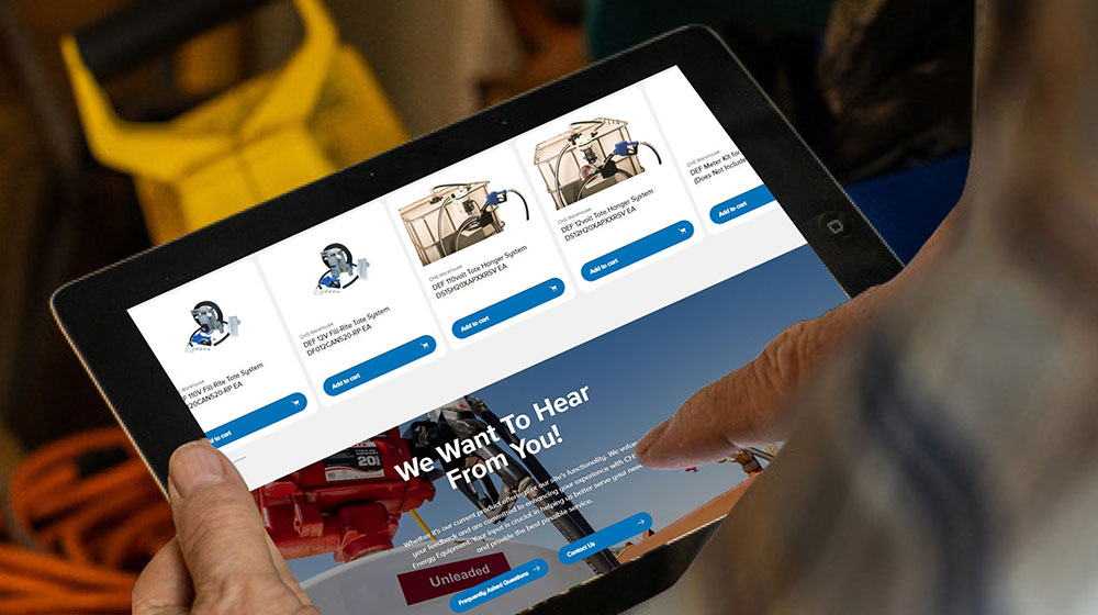 hands holding a tablet with a website shown