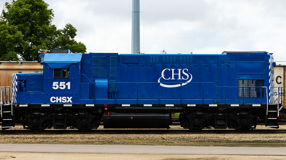Blue railcar with the CHS logo on the side. 