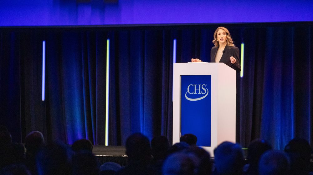 Olivia Nelligan speaking on stage at the 2025 CHS Annual Meeting 