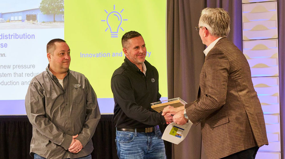 Men shaking hands as they receive Safety Excellence Award