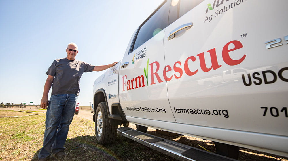 Man standing by pickup truck