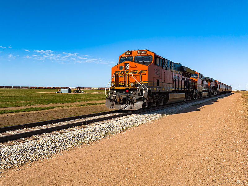 Train with rail cars on a track.